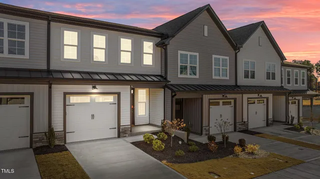 a front view of a house with many windows
