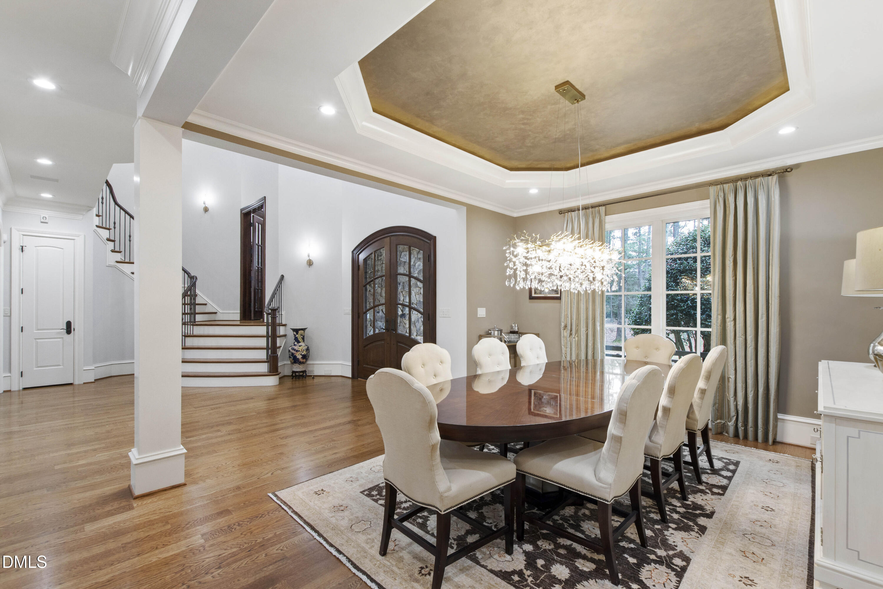 15508 Possum Track Road Raleigh, NC 27614 - Photo 25 of 85 a dining room with furniture a chandelier and wooden floor