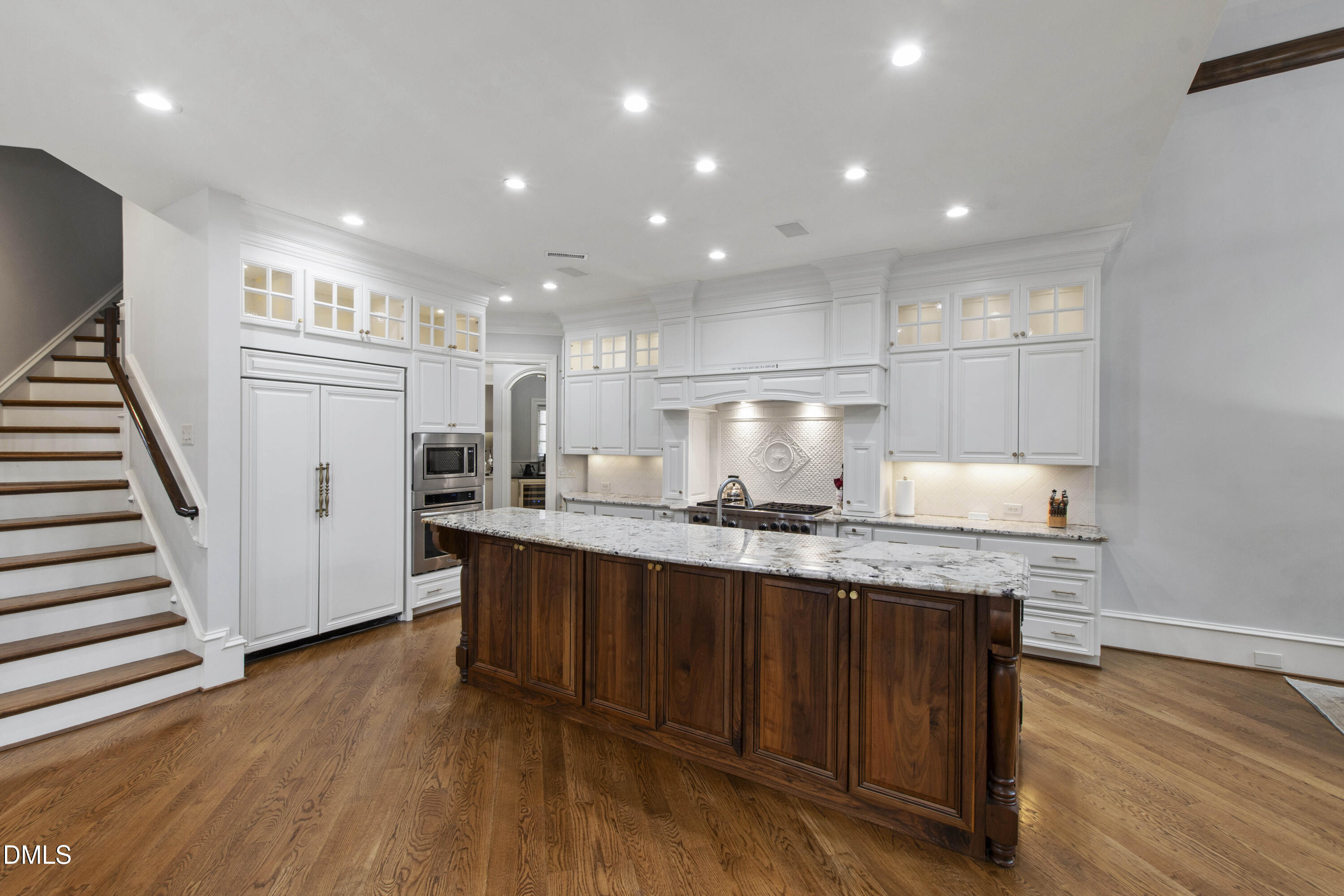 15508 Possum Track Road Raleigh, NC 27614 - Photo 29 of 85 a kitchen with granite countertop a stove a sink and a refrigerator with wooden floor