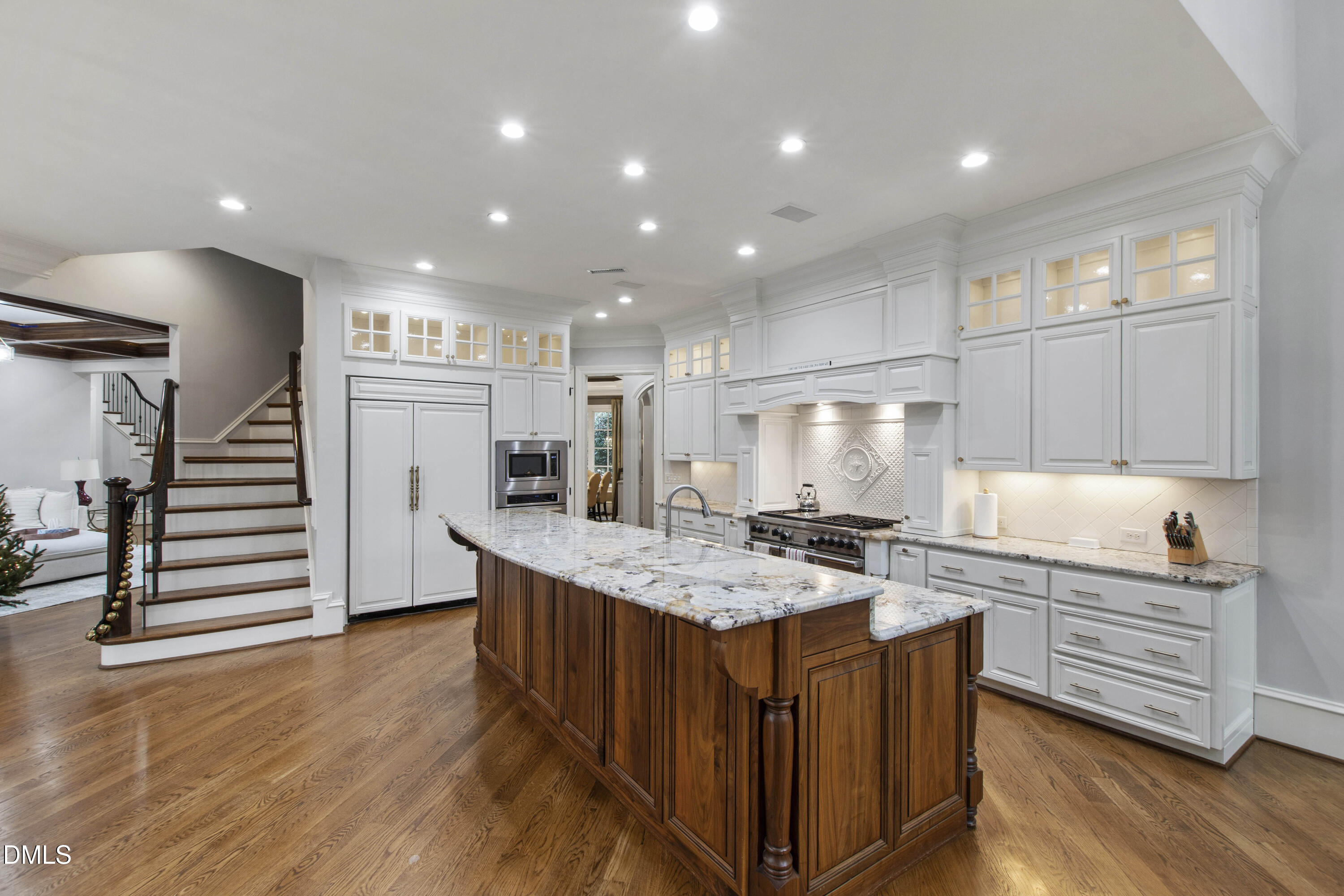 15508 Possum Track Road Raleigh, NC 27614 - Photo 30 of 85 a kitchen with stainless steel appliances granite countertop a sink stove and wooden floor