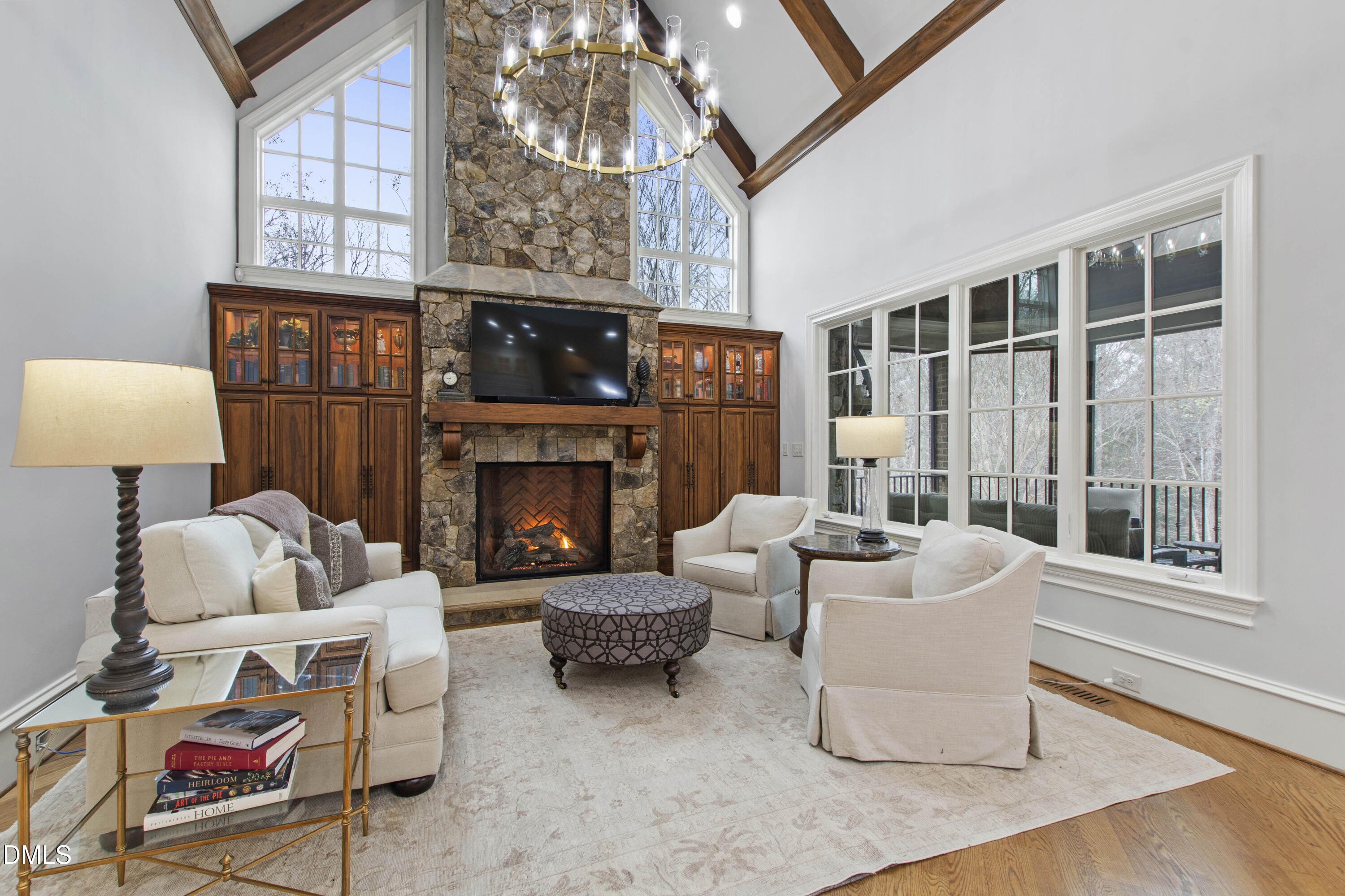 15508 Possum Track Road Raleigh, NC 27614 - Photo 34 of 85 a living room with furniture a fireplace and a large window