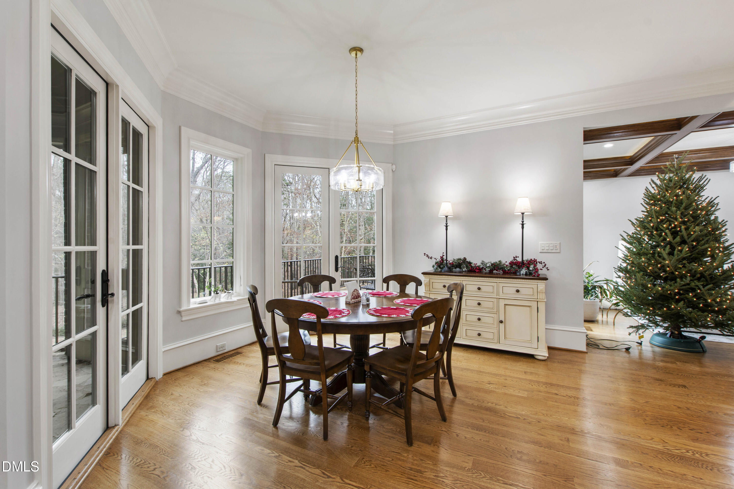 15508 Possum Track Road Raleigh, NC 27614 - Photo 37 of 85 a dining room with furniture window and wooden floor
