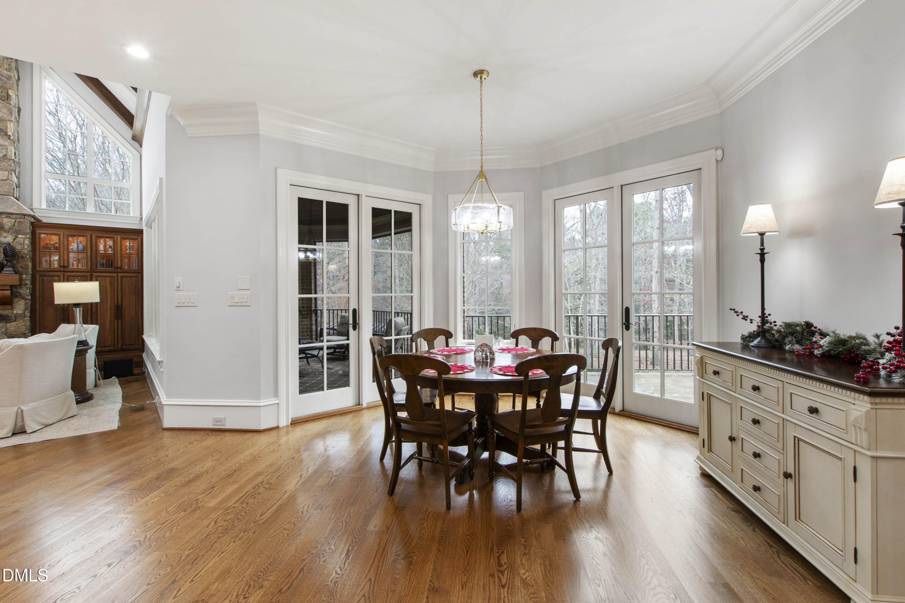 15508 Possum Track Road Raleigh, NC 27614 - Photo 38 of 85 a view of a dining room with furniture window and wooden floor