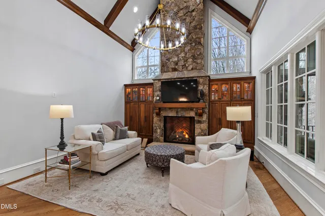 a bathroom with a granite countertop sink mirror and shower
