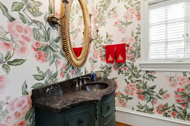 a bathroom with a sink and a shower curtain