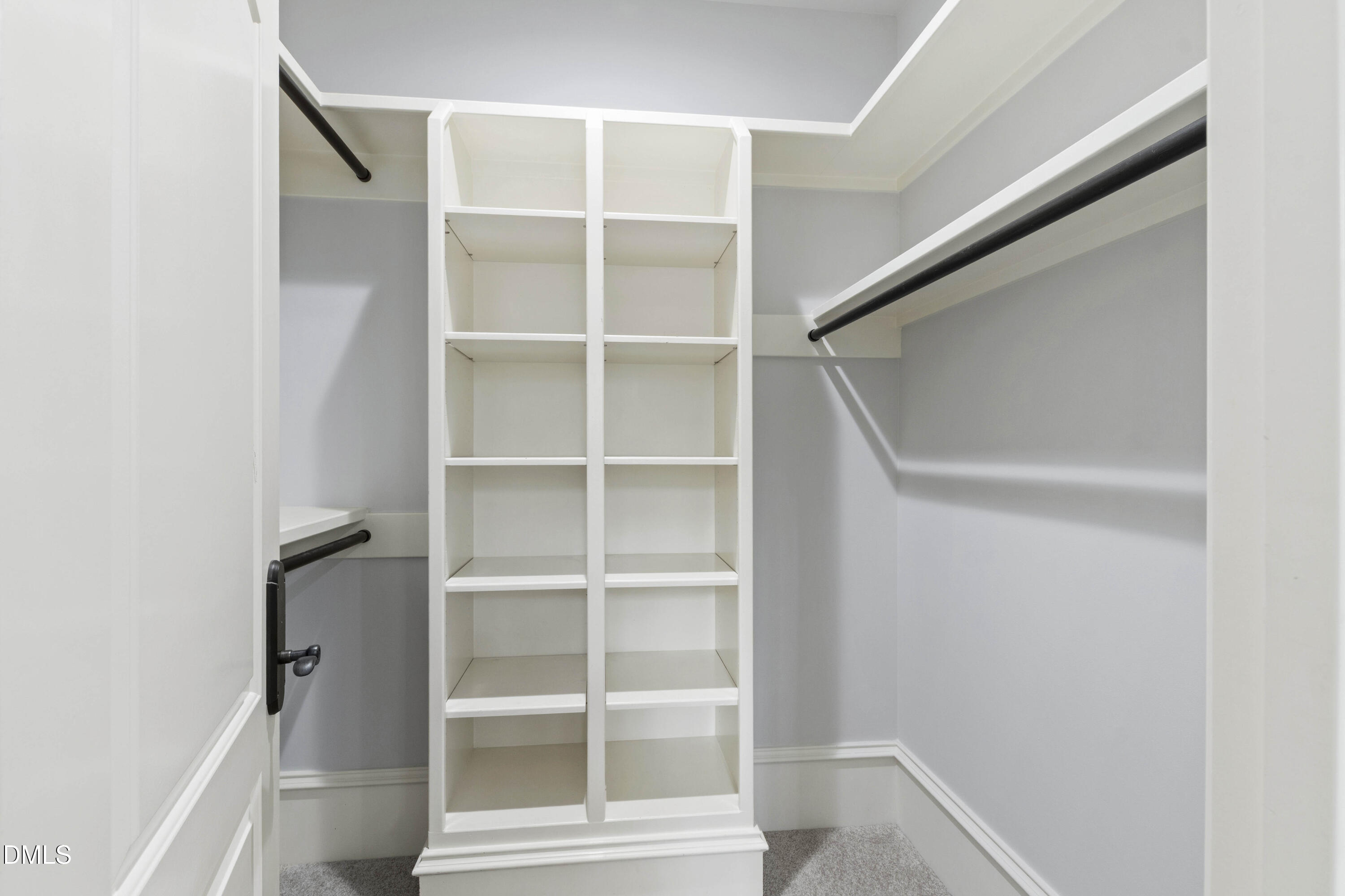 15508 Possum Track Road Raleigh, NC 27614 - Photo 56 of 85 a view of walk in closet with empty racks