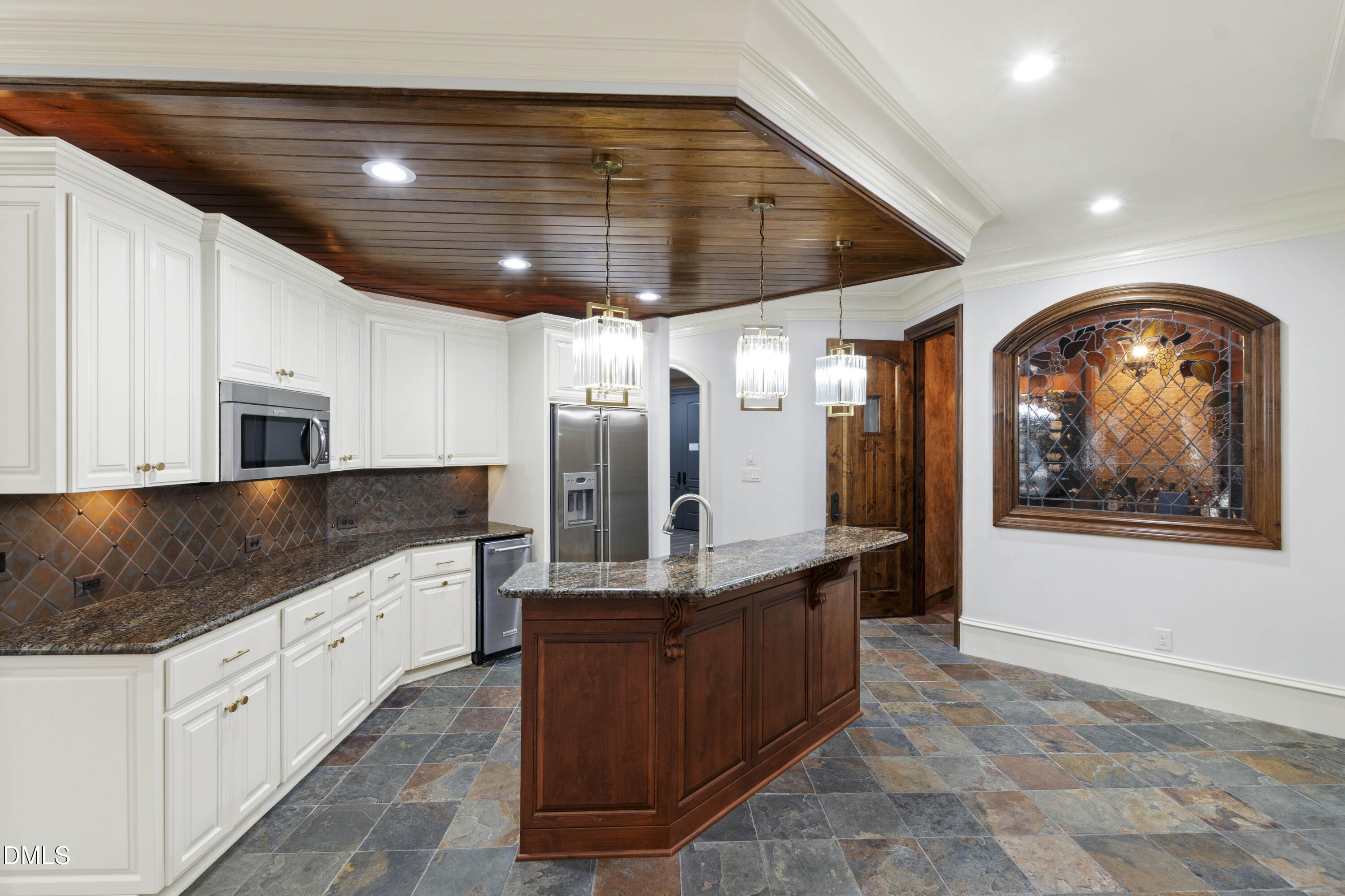 15508 Possum Track Road Raleigh, NC 27614 - Photo 62 of 85 a large kitchen with stainless steel appliances kitchen island granite countertop a stove and a sink