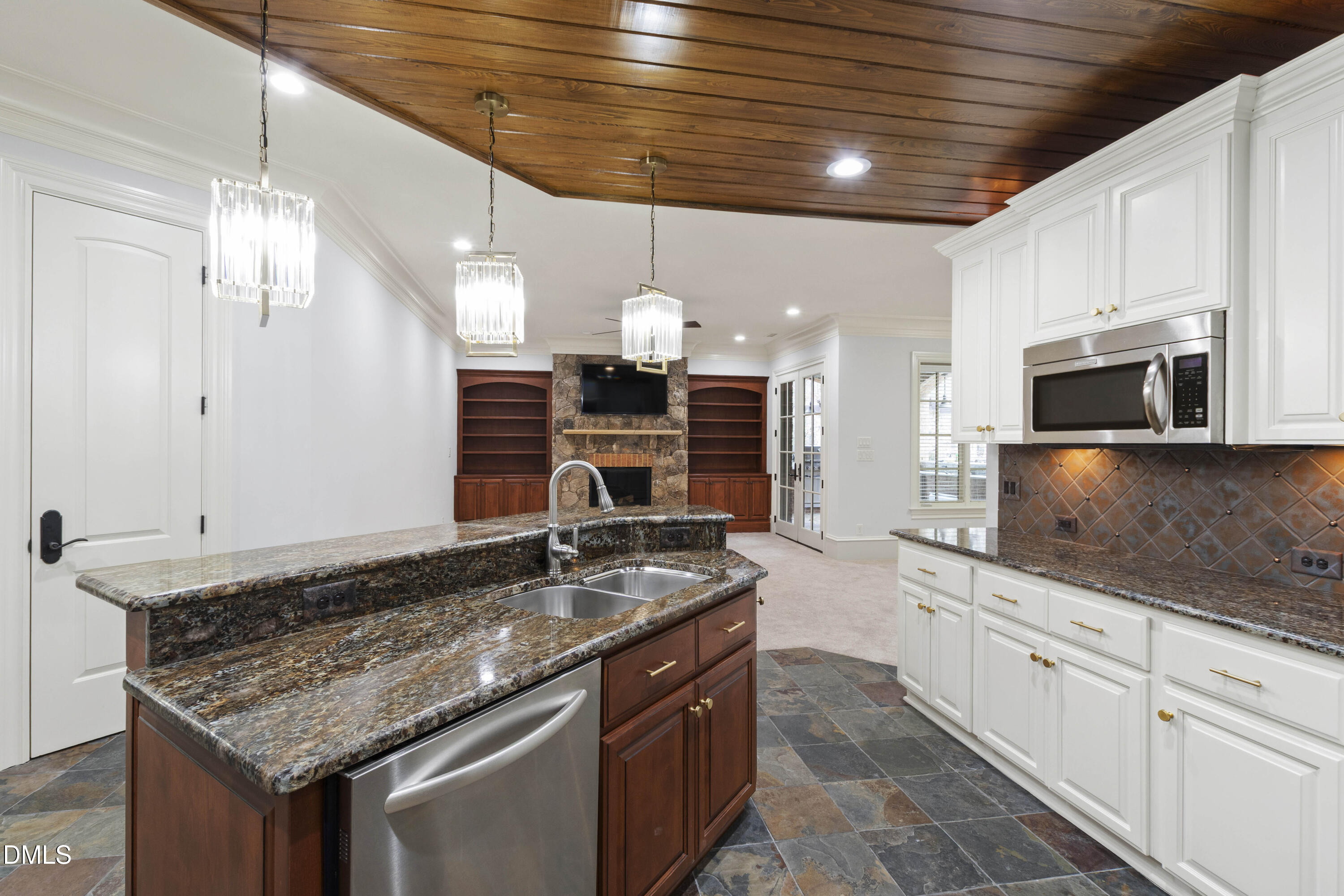 15508 Possum Track Road Raleigh, NC 27614 - Photo 65 of 85 a kitchen with stainless steel appliances granite countertop a sink and stove