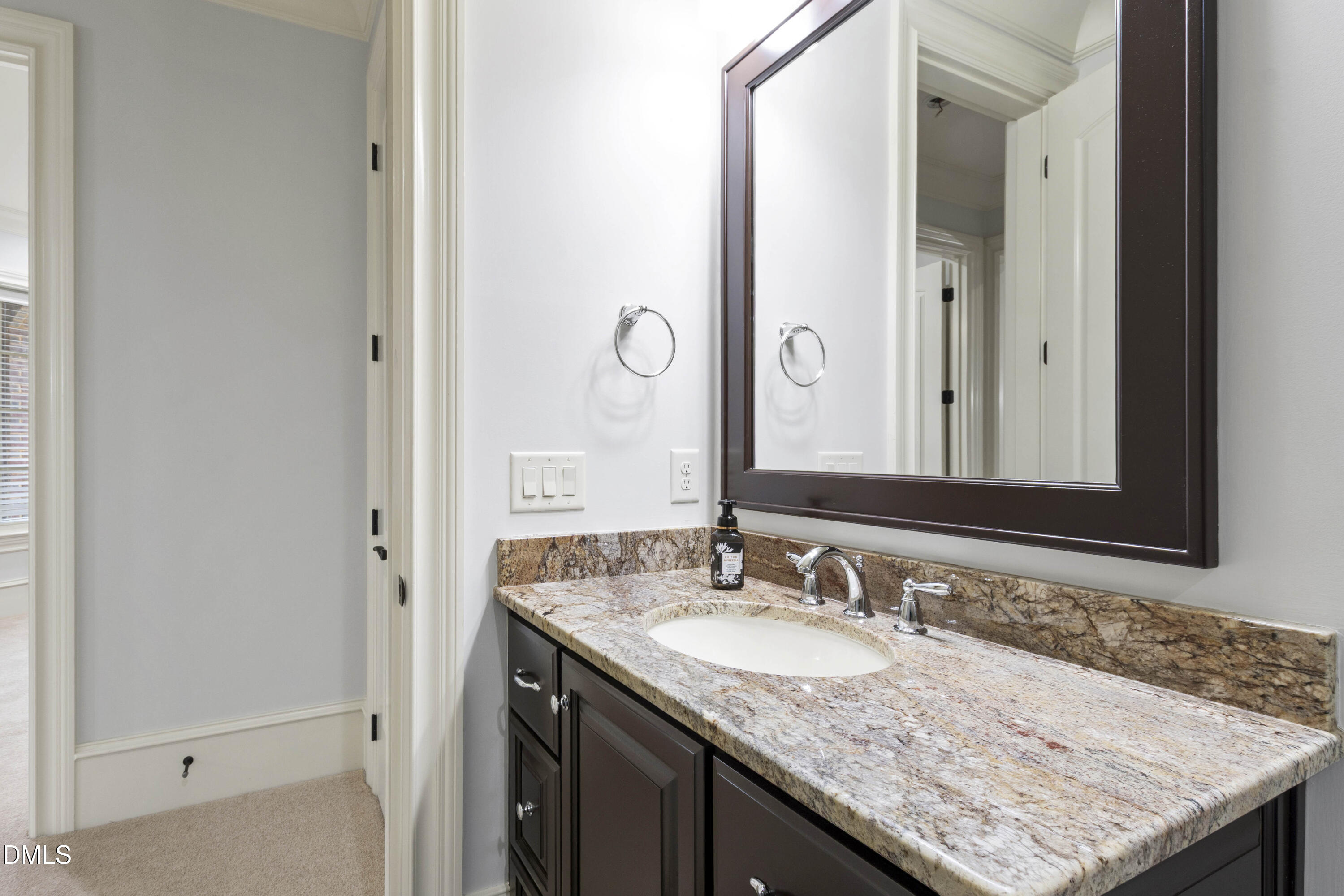 15508 Possum Track Road Raleigh, NC 27614 - Photo 79 of 85 a bathroom with a granite countertop sink and a mirror
