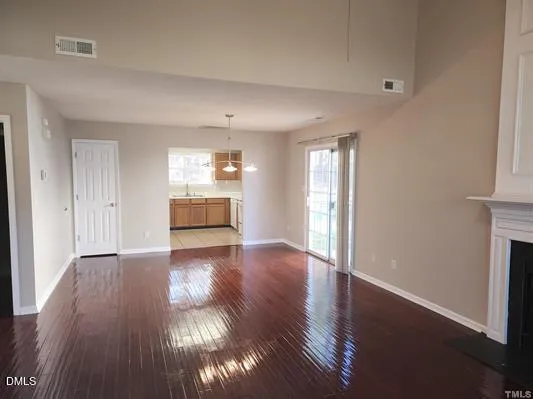 a room with a fireplace and a window