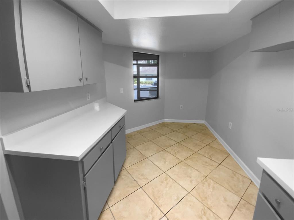 2131 Ridge Road South, Unit 80 Largo, FL 33778 - Photo 14 of 27 a view of kitchen and empty room