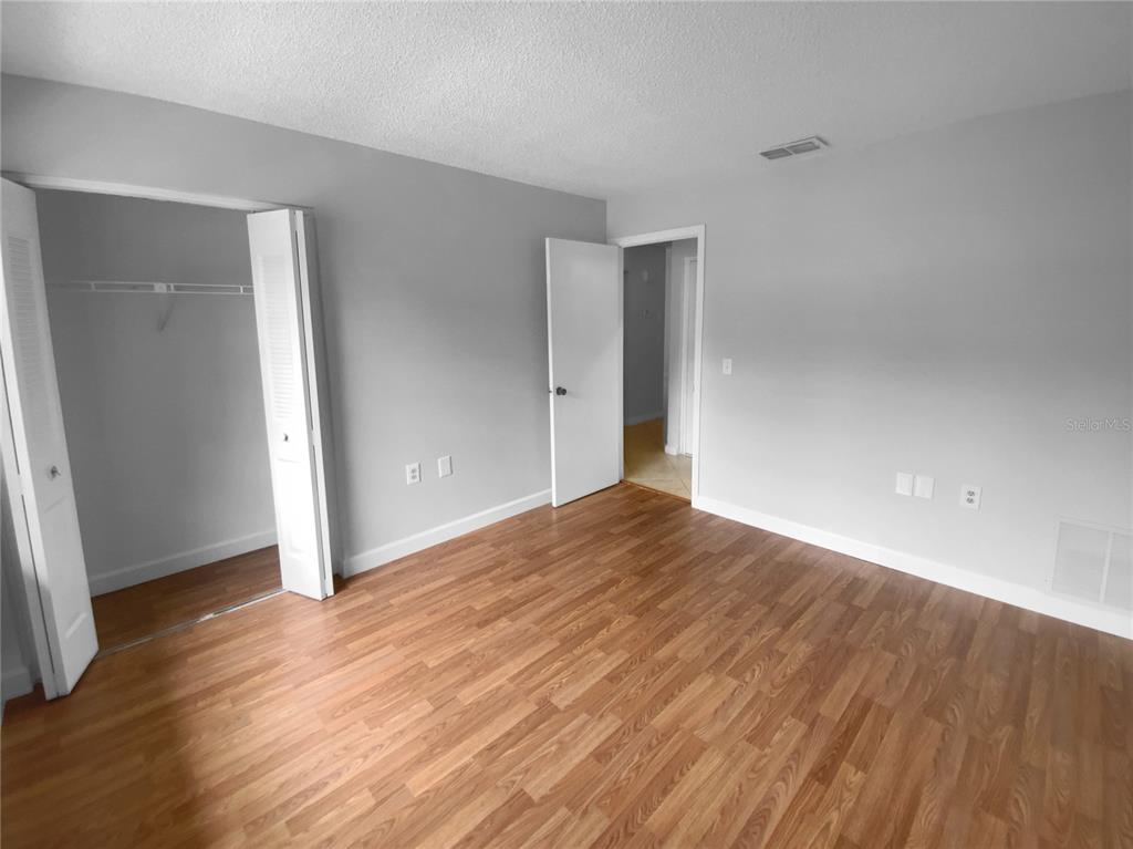 2131 Ridge Road South, Unit 80 Largo, FL 33778 - Photo 16 of 27 a view of empty room with wooden floor