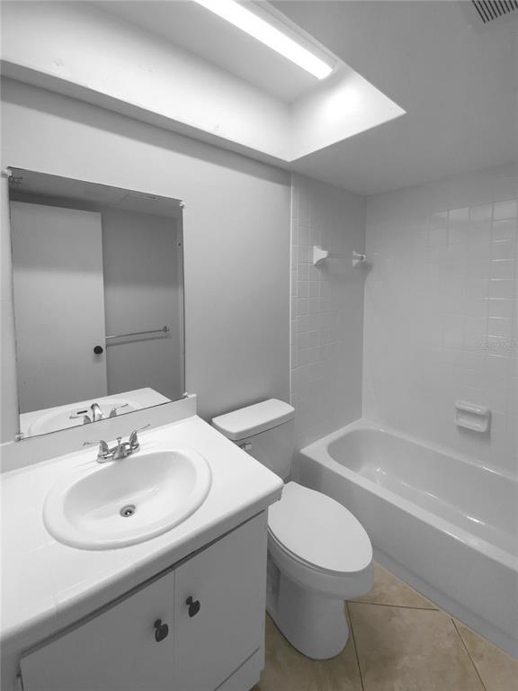 2131 Ridge Road South, Unit 80 Largo, FL 33778 - Photo 19 of 27 a bathroom with a sink toilet and shower
