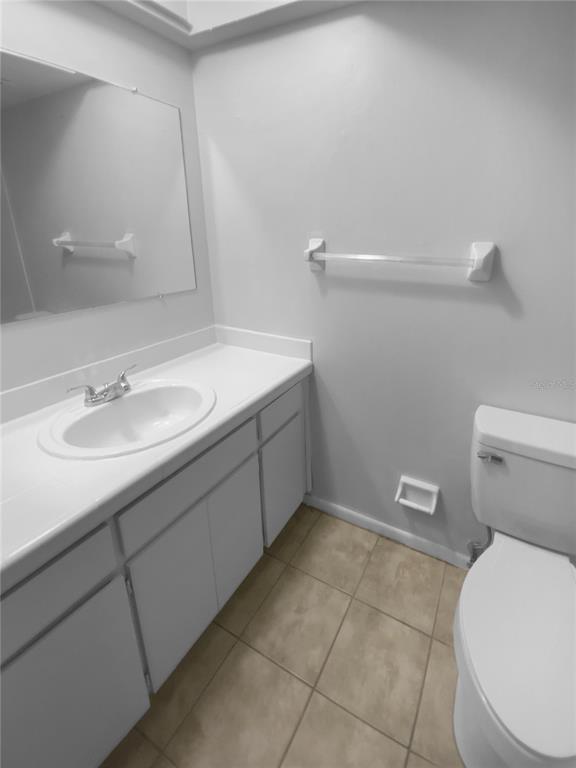 2131 Ridge Road South, Unit 80 Largo, FL 33778 - Photo 22 of 27 a bathroom with a sink toilet and vanity