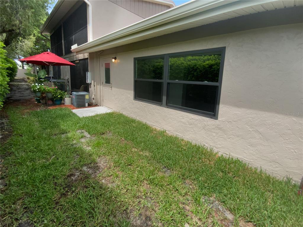 2131 Ridge Road South, Unit 80 Largo, FL 33778 - Photo 23 of 27 a front view of a house with a yard