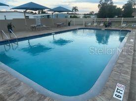 2131 Ridge Road South, Unit 80 Largo, FL 33778 - Photo 24 of 27 a view of a lake with outdoor space