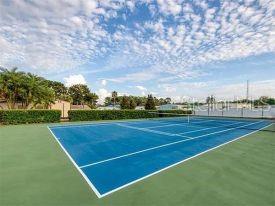 2131 Ridge Road South, Unit 80 Largo, FL 33778 - Photo 26 of 27 a view of an outdoor space and tennis court