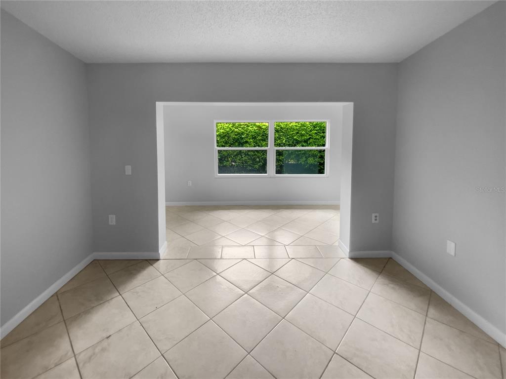 2131 Ridge Road South, Unit 80 Largo, FL 33778 - Photo 7 of 27 an empty room with a window