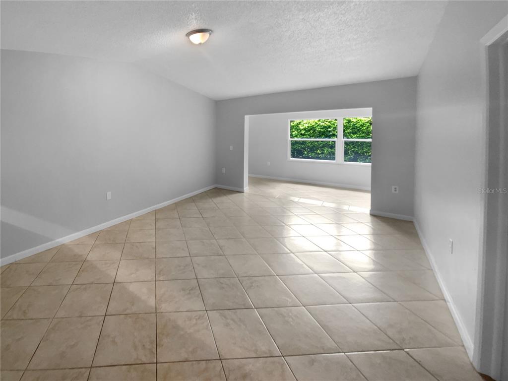 2131 Ridge Road South, Unit 80 Largo, FL 33778 - Photo 8 of 27 a view of an empty room with a window