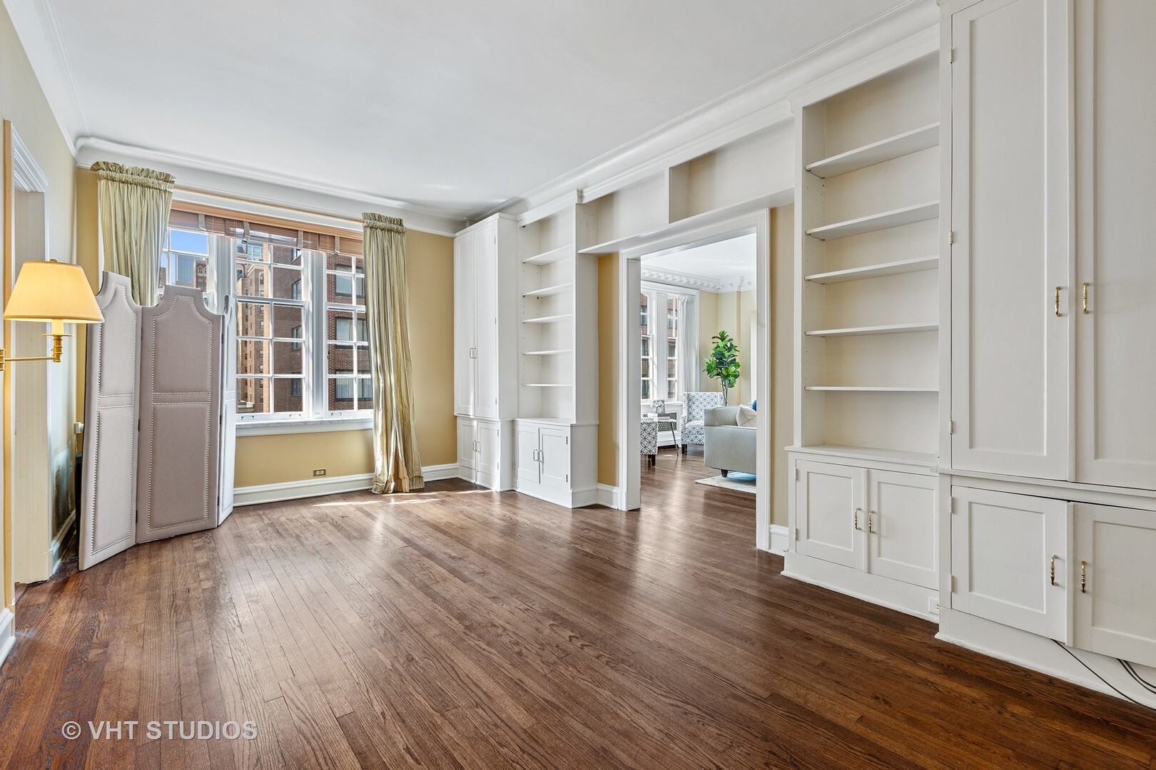 220 East Walton Place, Unit 9W Chicago, IL 60611 - Photo 13 of 21 an empty room with wooden floor and windows