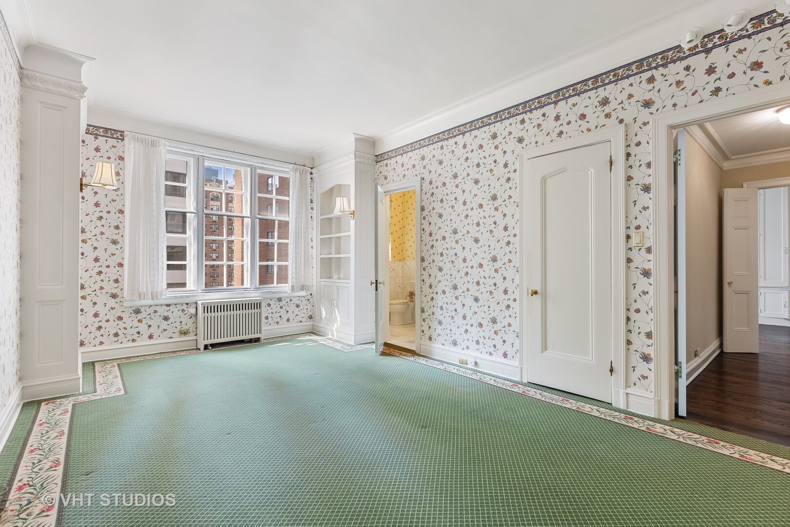 220 East Walton Place, Unit 9W Chicago, IL 60611 - Photo 15 of 21 an empty room with windows