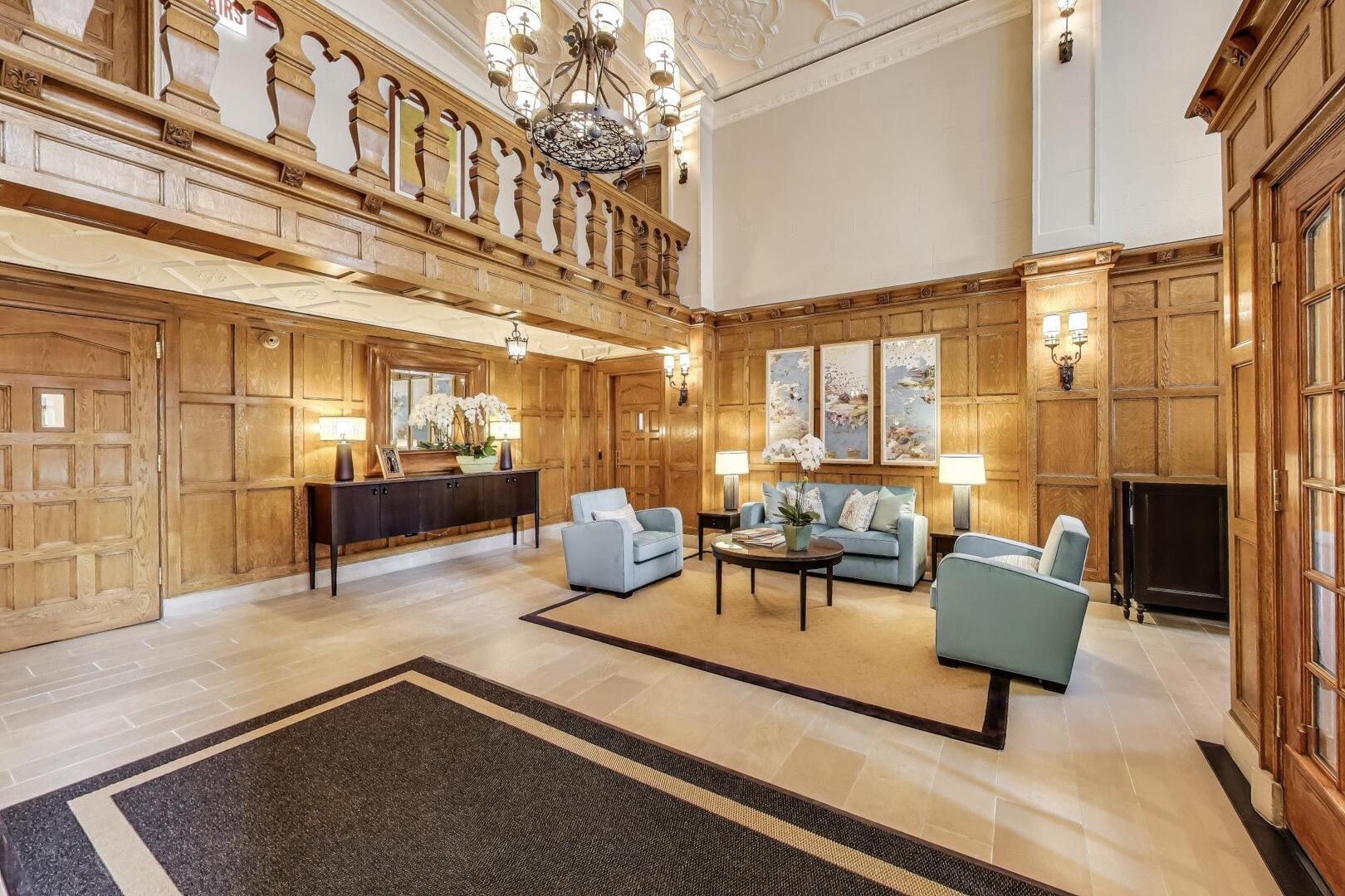 220 East Walton Place, Unit 9W Chicago, IL 60611 - Photo 21 of 21 a living room with furniture and a chandelier