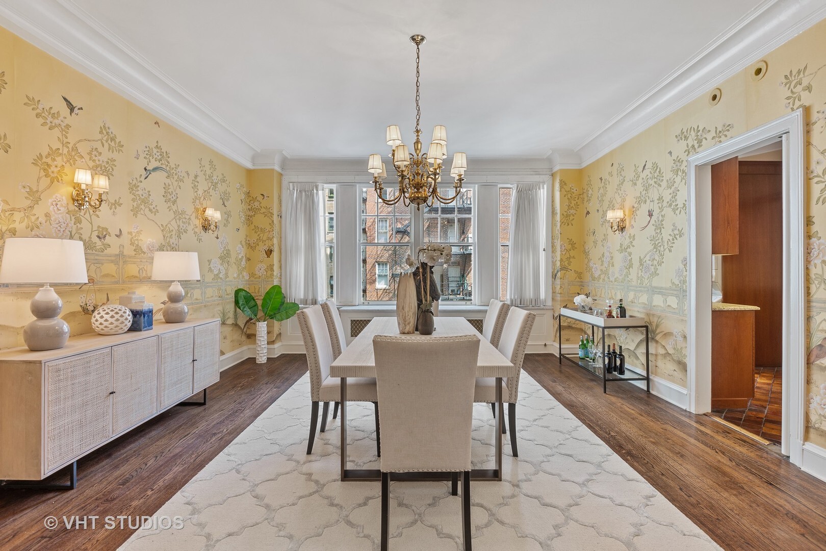 220 East Walton Place, Unit 9W Chicago, IL 60611 - Photo 9 of 19 a view of a dining room with furniture window and wooden floor