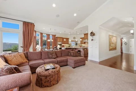 a view of a livingroom with workspace and a bookshelf