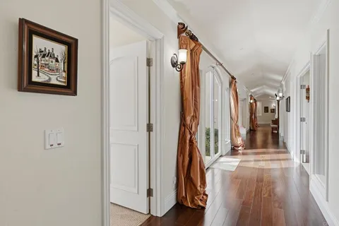 a spacious bathroom with a tub sink and mirror