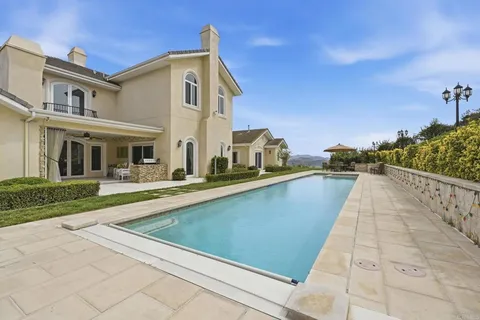 a view of a back yard of the house