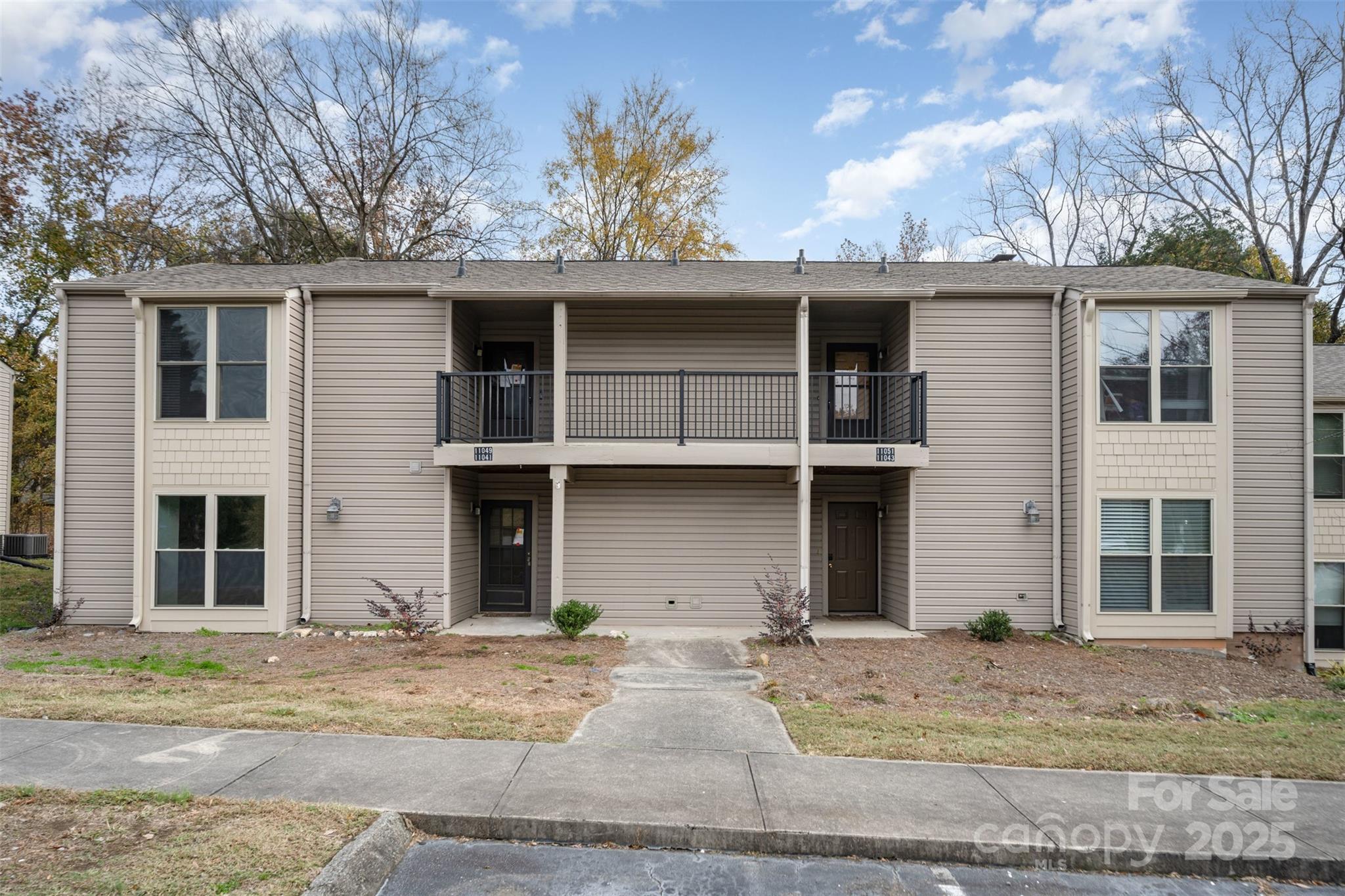 11049 Cedar View Road Charlotte, NC 28226 - Photo 3 of 19 a view of a house with a patio and a tree