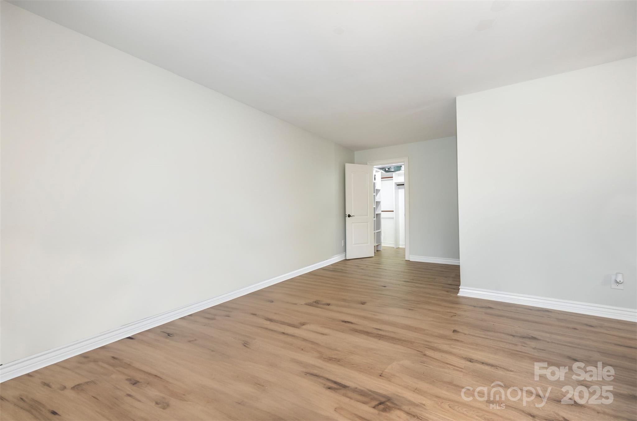 11049 Cedar View Road Charlotte, NC 28226 - Photo 10 of 19 a view of empty room with wooden floor