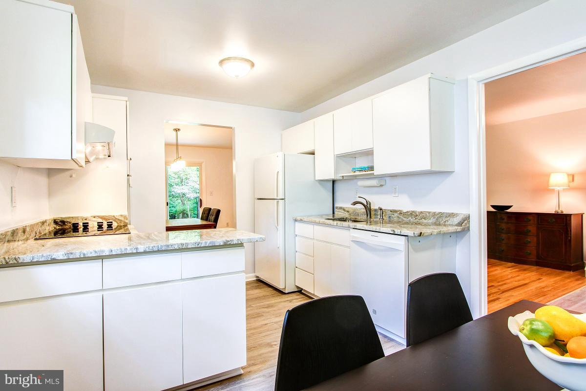 10822 Margate Road Silver Spring, MD 20901 - Photo 14 of 29 a kitchen with furniture a window and a sink