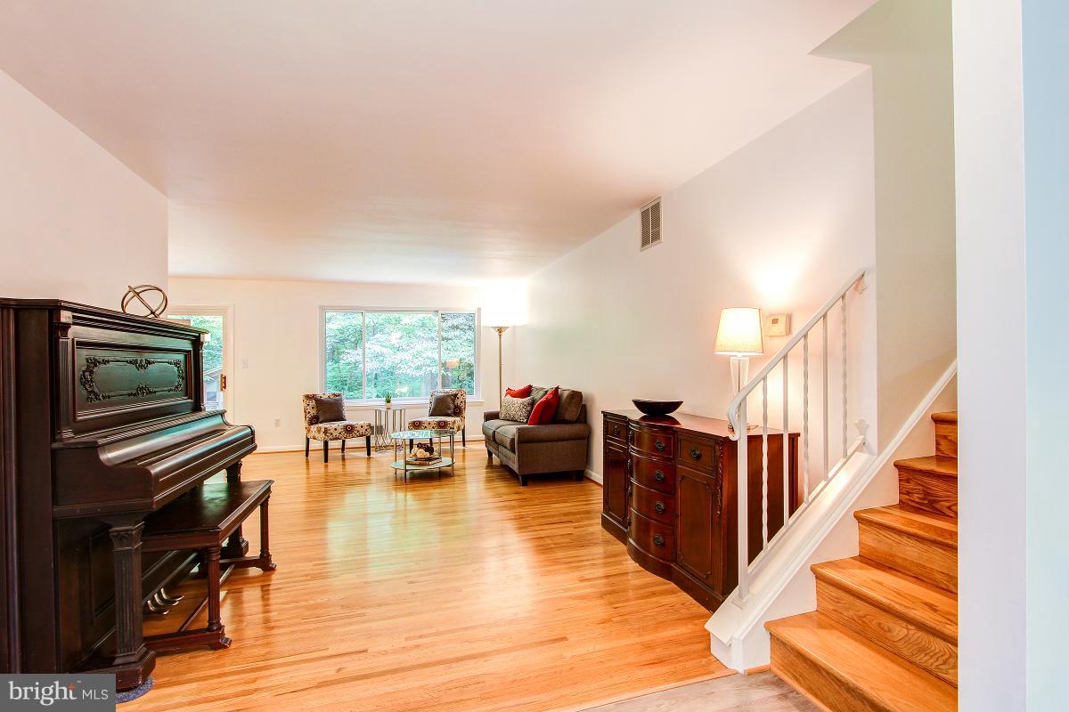 10822 Margate Road Silver Spring, MD 20901 - Photo 3 of 29 a living room with furniture and wooden floor