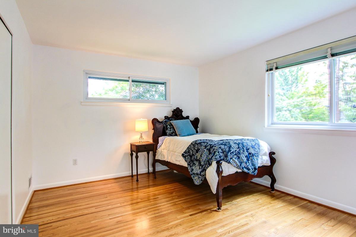 10822 Margate Road Silver Spring, MD 20901 - Photo 21 of 29 a living room with a bed furniture and a window