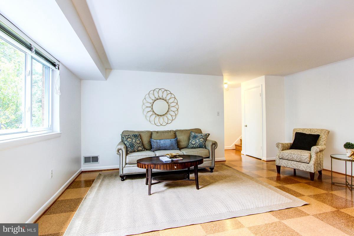 10822 Margate Road Silver Spring, MD 20901 - Photo 22 of 29 a living room with furniture and a window