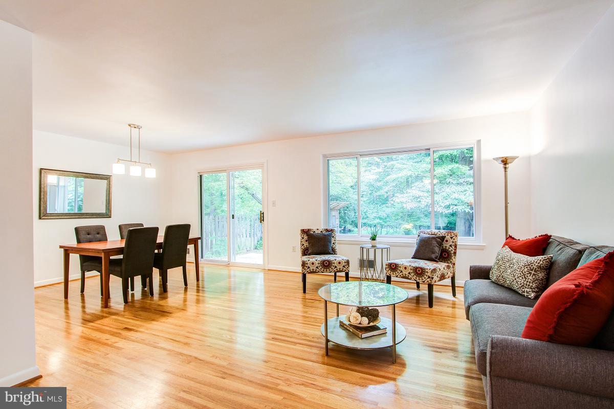 10822 Margate Road Silver Spring, MD 20901 - Photo 4 of 29 a living room with furniture dining area and wooden floor