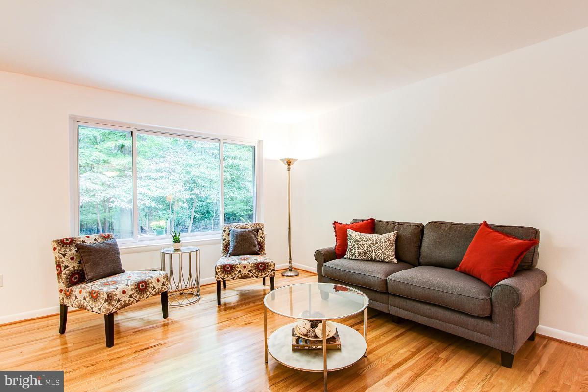 10822 Margate Road Silver Spring, MD 20901 - Photo 5 of 29 a living room with furniture and a large window