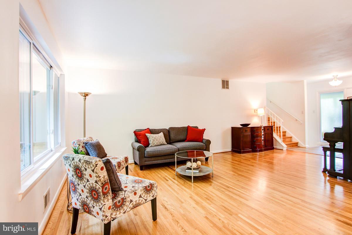 10822 Margate Road Silver Spring, MD 20901 - Photo 7 of 29 a living room with furniture and a wooden floor
