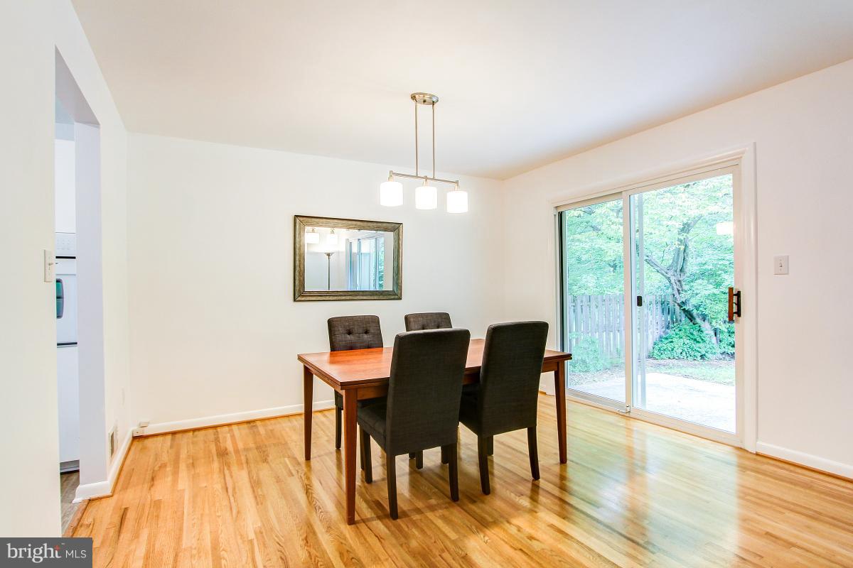 10822 Margate Road Silver Spring, MD 20901 - Photo 8 of 29 a view of a dining room with furniture window and wooden floor