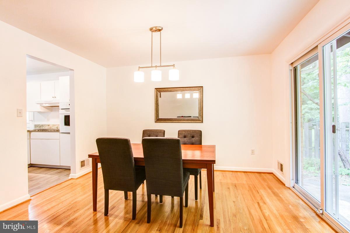 10822 Margate Road Silver Spring, MD 20901 - Photo 9 of 29 a view of a dining room with furniture and wooden floor