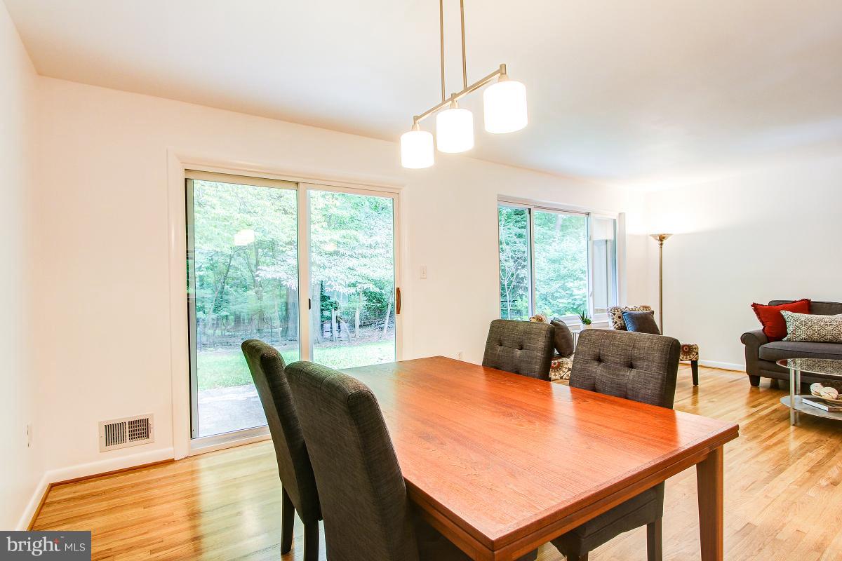 10822 Margate Road Silver Spring, MD 20901 - Photo 10 of 29 a dining room with furniture and wooden floor