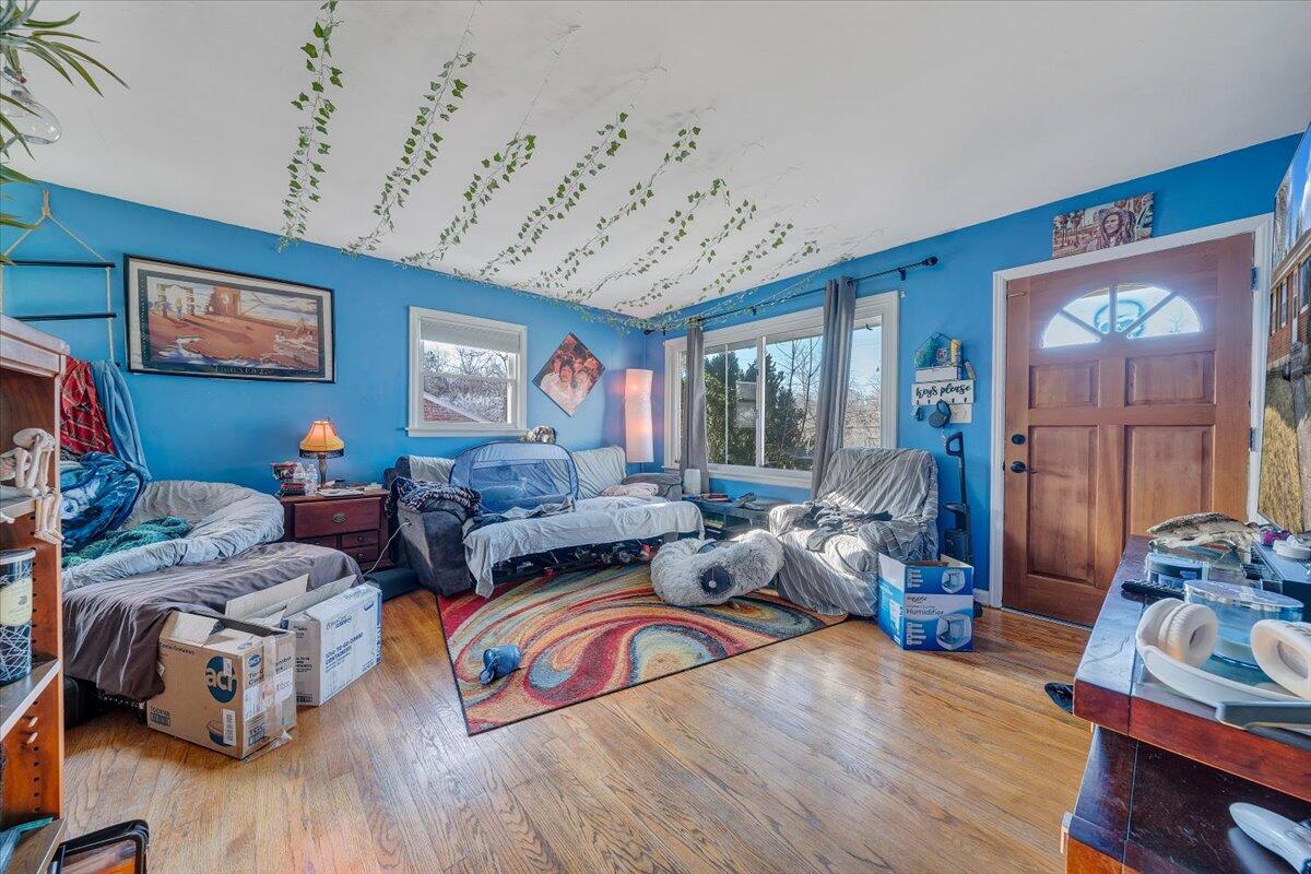 4928 Rowe Ridge Road Northwest Roanoke, VA 24017 - Photo 3 of 11 a living room with furniture a wooden floor and next to a window