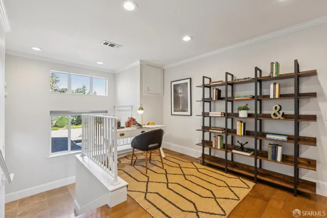 a workspace with furniture and book shelf