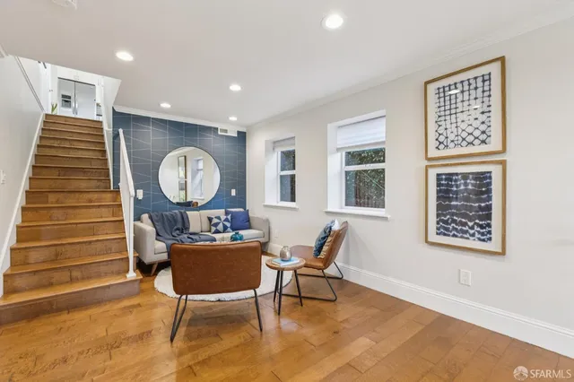 a workspace room with furniture and wooden floor