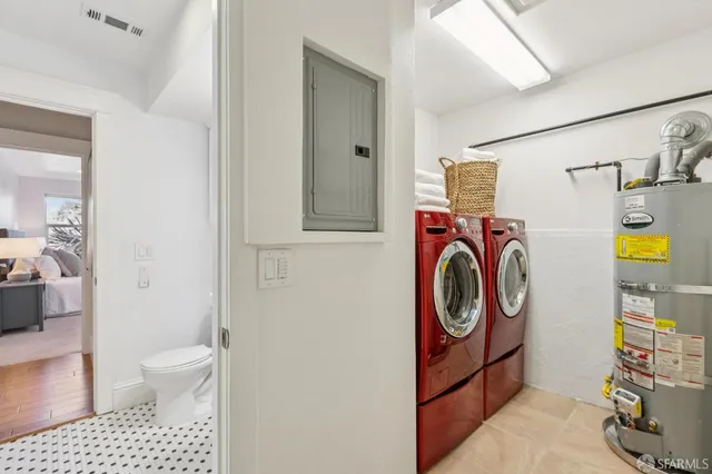 a bathroom with a sink a washer and dryer
