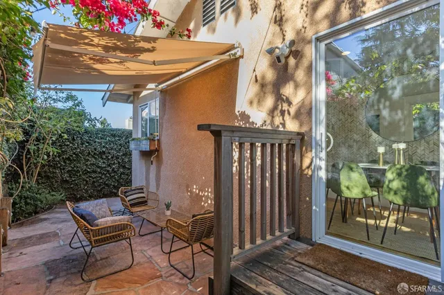 a view of a two chairs in the balcony