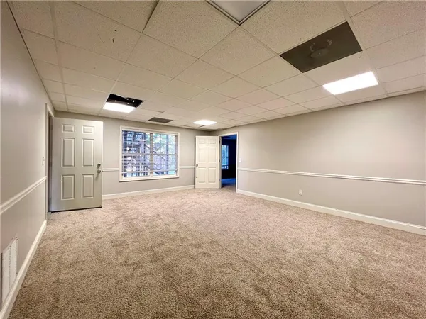 a view of an empty room with a window