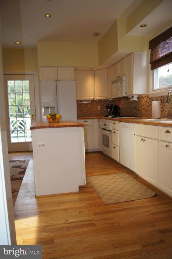 522 Murdock Road Baltimore, MD 21212 - Photo 3 of 30 Hardwood flooring and island create open feel
