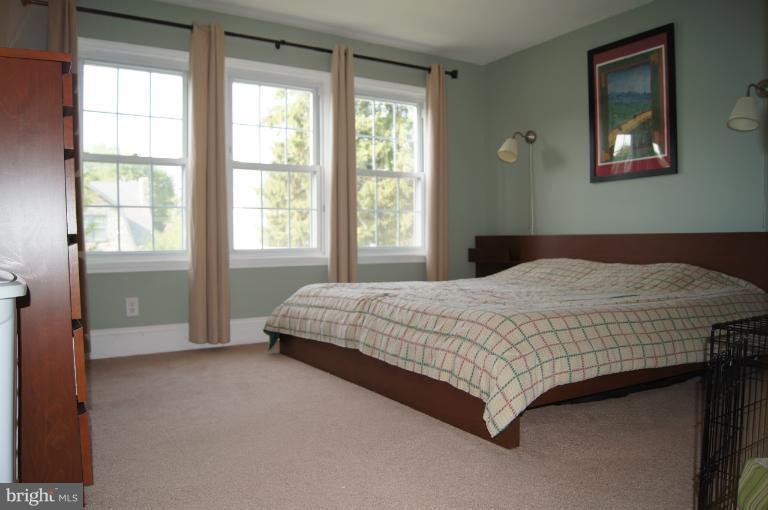 522 Murdock Road Baltimore, MD 21212 - Photo 5 of 30 Master bedroom with carpet over hardwood